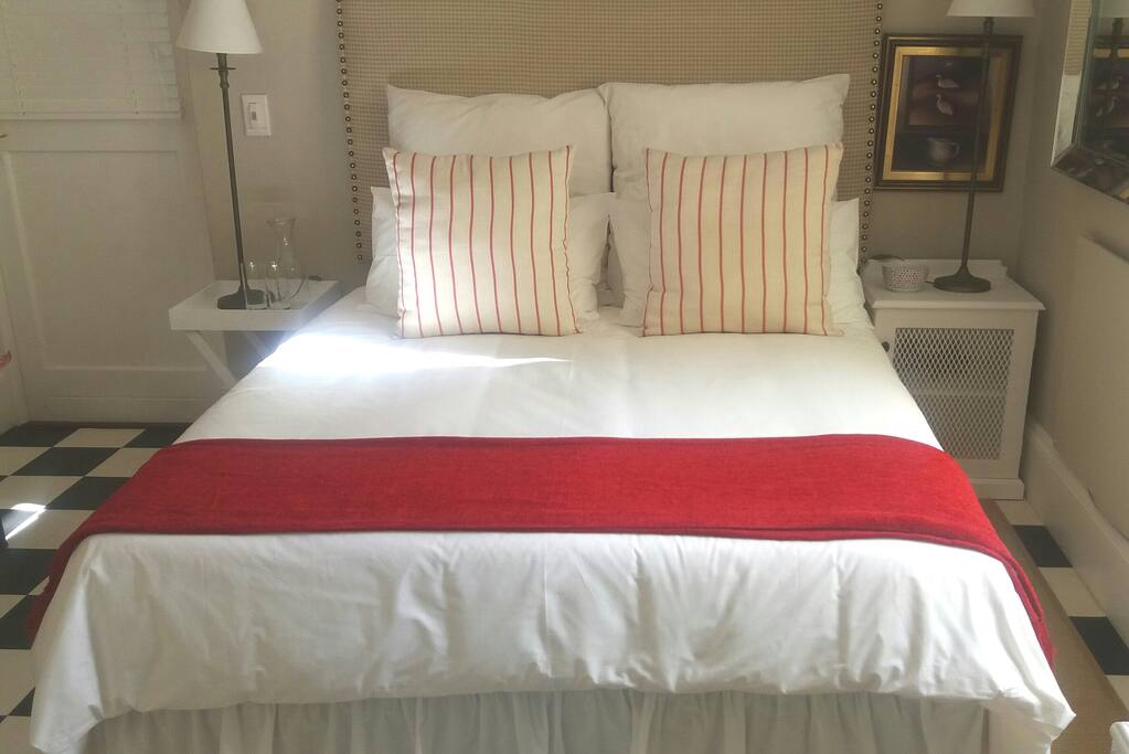 Luxurious queen bed with 100% cotton bedding