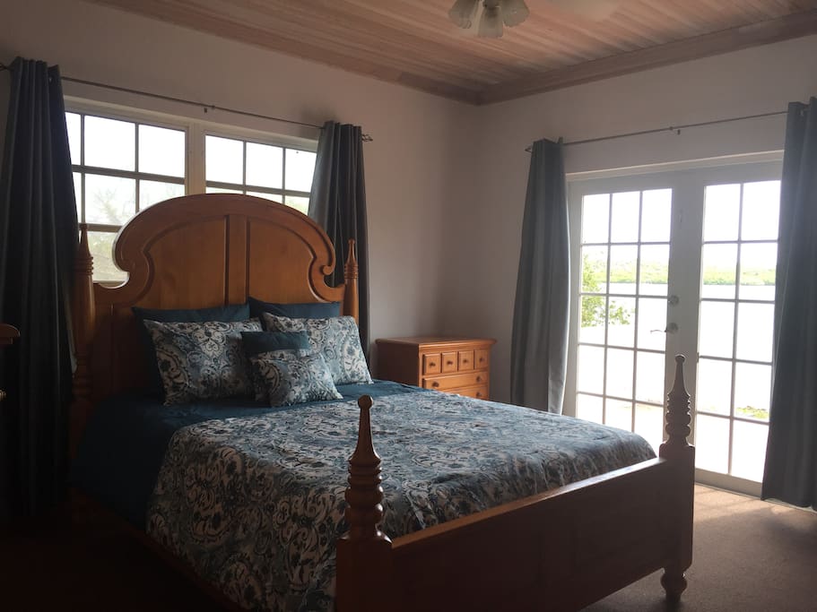Master bedroom, with French doors to back patio and ocean front