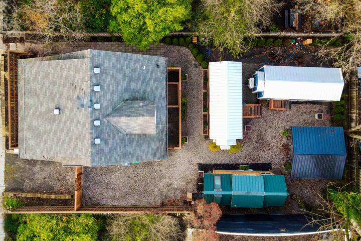 Restored Farmhouse & Backyard Tiny House Village
