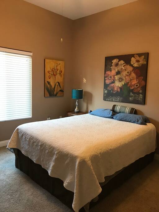 Queen bed, large bedroom, ceiling fan, with full bath next to room. One of two rooms available.