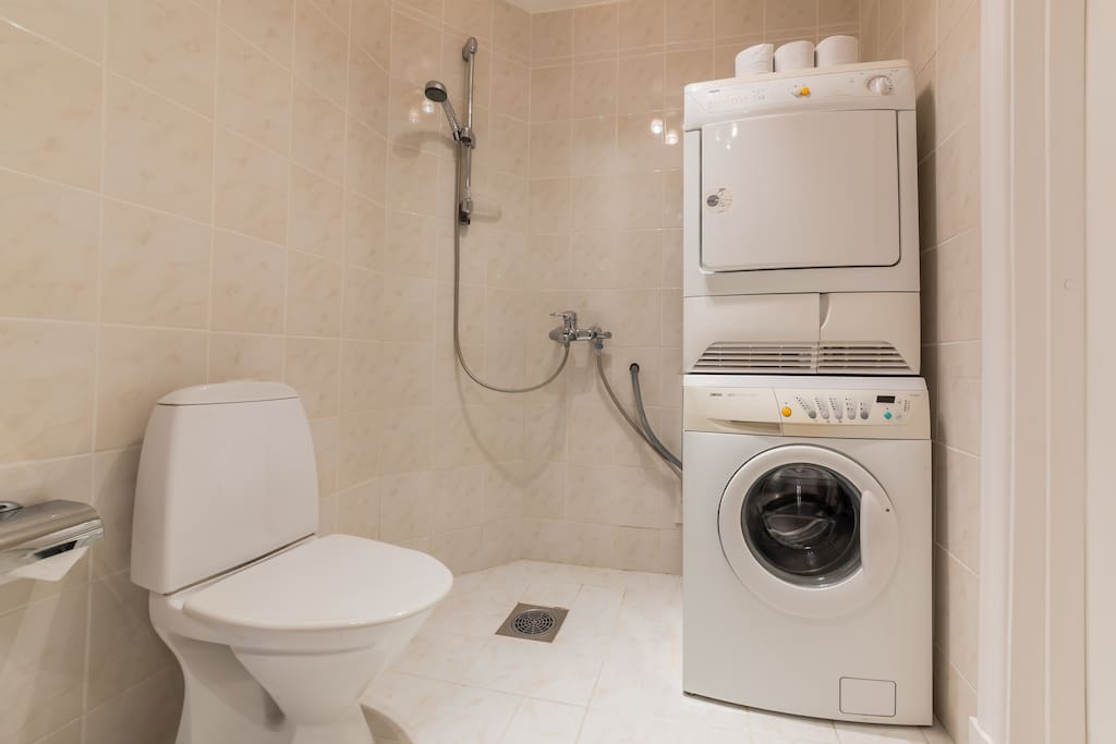 Common bathroom with washer and dryer
