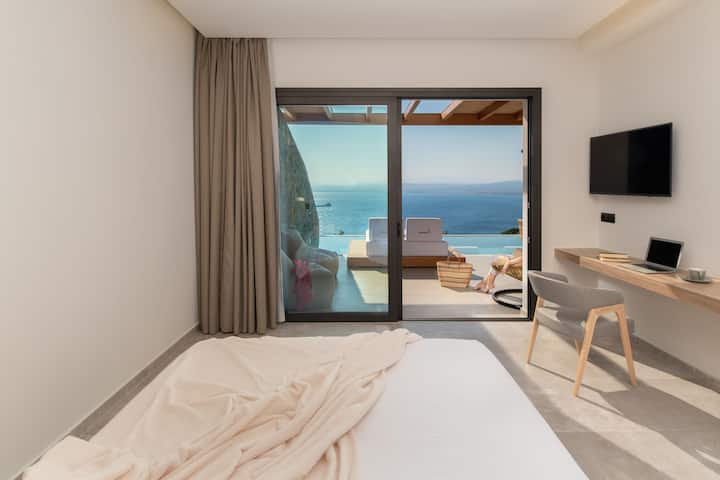 Floor-to-ceiling glass doors offer beautiful sea views and access to the pool!