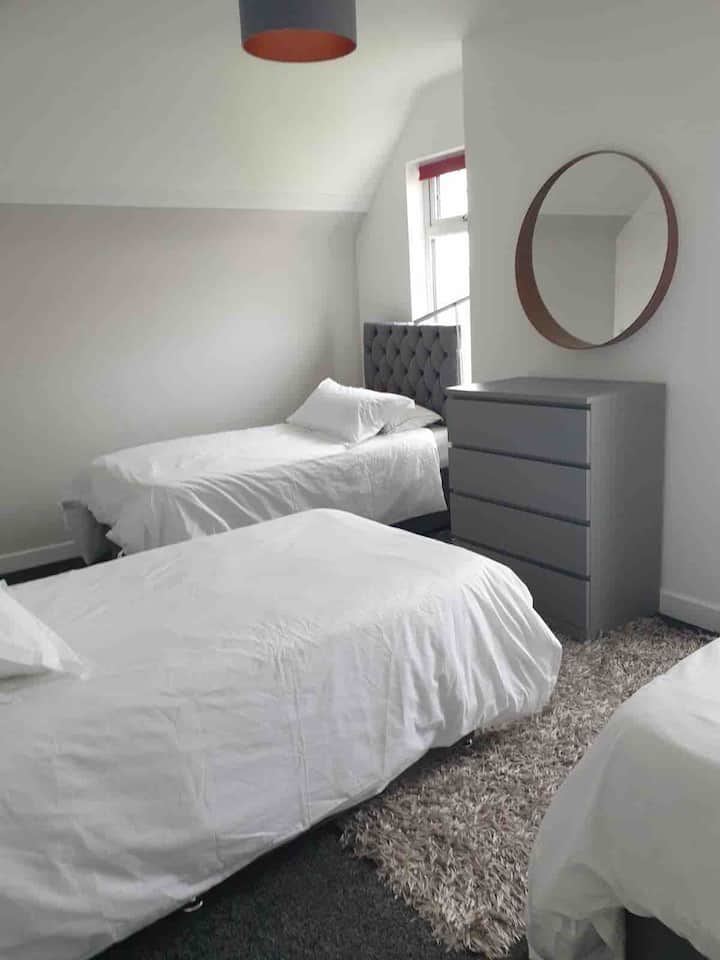 Large bedroom made up as 3 singles 