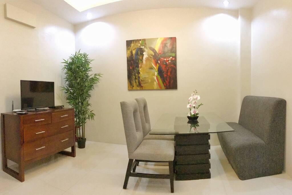 Living/Dining room w/ a flat screen LED TV for your entertainment.