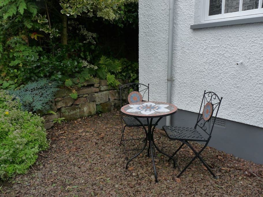 Small outdoor seating area perfect for morning coffee and evening drinks....