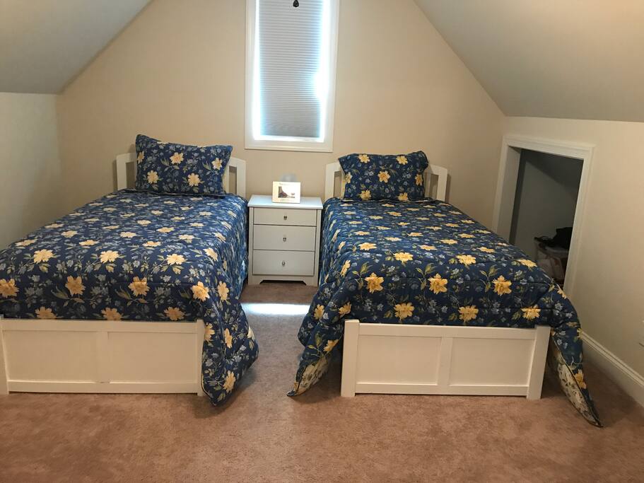 Private bedroom with two extra long twin beds