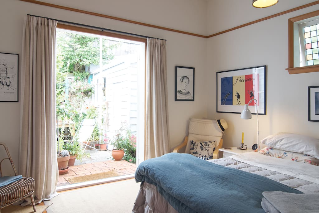 French doors open from bedroom onto private garden area