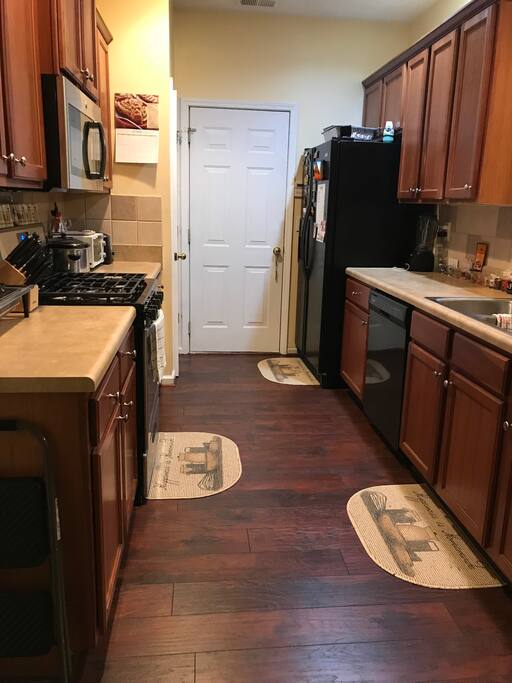 Full kitchen with many appliances. Charcoal grill is available on the outside patio