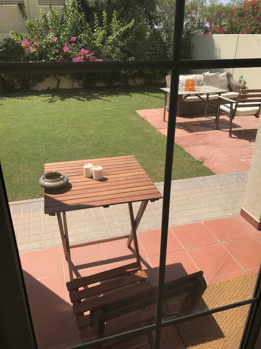 Garden with seating area. Perfect for breakfast and morning coffee