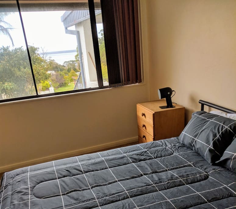 Queen size bed and view from bedroom 1