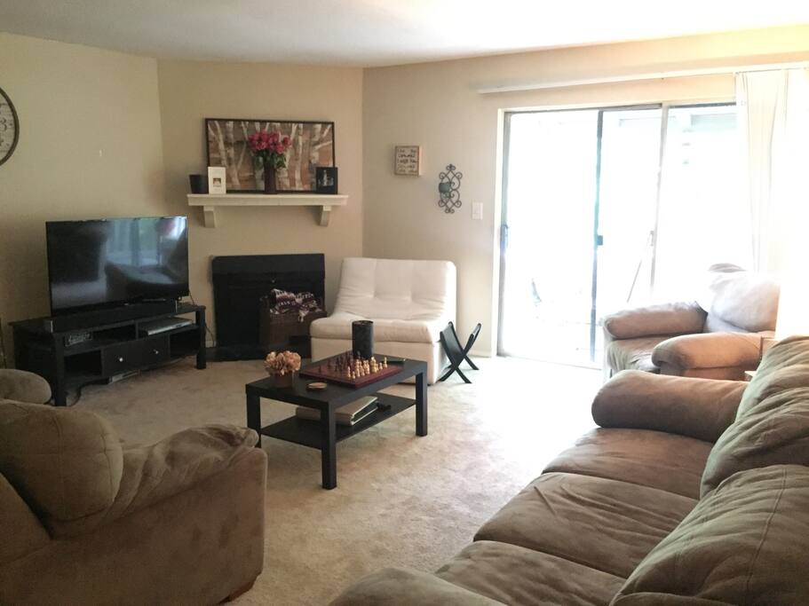 This is the living room ! Big open and nicely lit area .