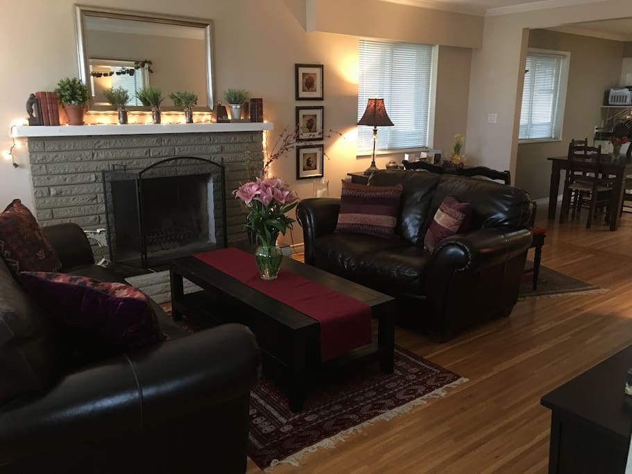 Front living room is airy and bright, leads into dining room and kitchen, very spacious