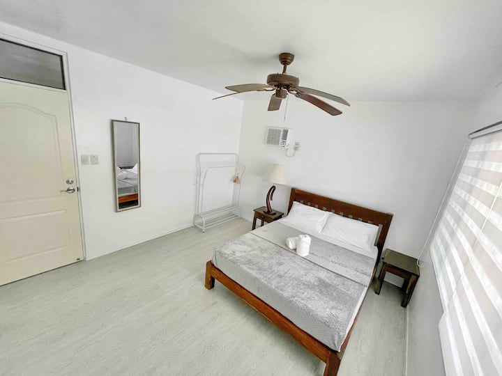 Bedroom 1. Equipped with a Queen sized bed for 2 and an option to add an 2 extra mattresses. Comes with ceiling fan to complement the breeze of Tagaytay's fresh air. This room also has air-conditioner. 

