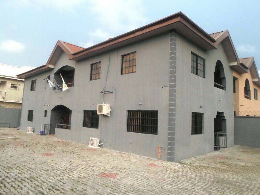 Outdoor space with ample parking space and balcony