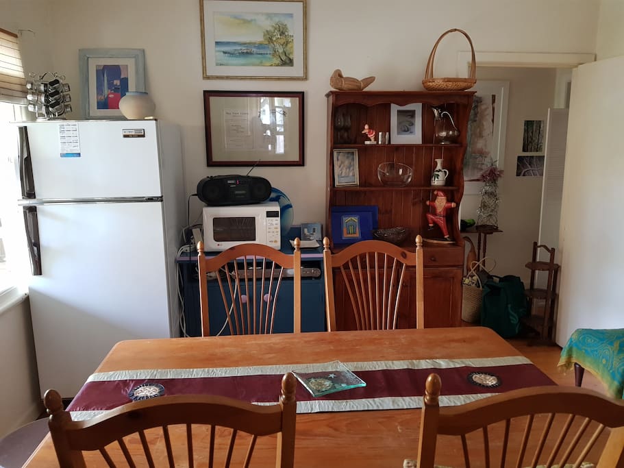 Home away from home - microwave, hotplates, electric barbecue grill and frypan, pots and pans, crockery.