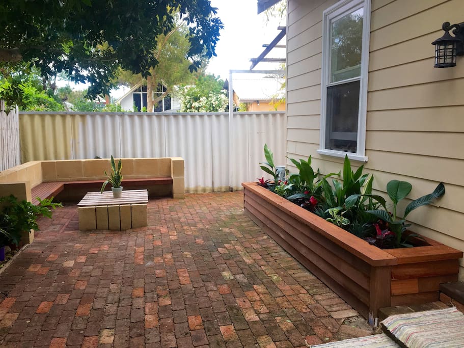 Outdoor entertaining area with fire pit/table.