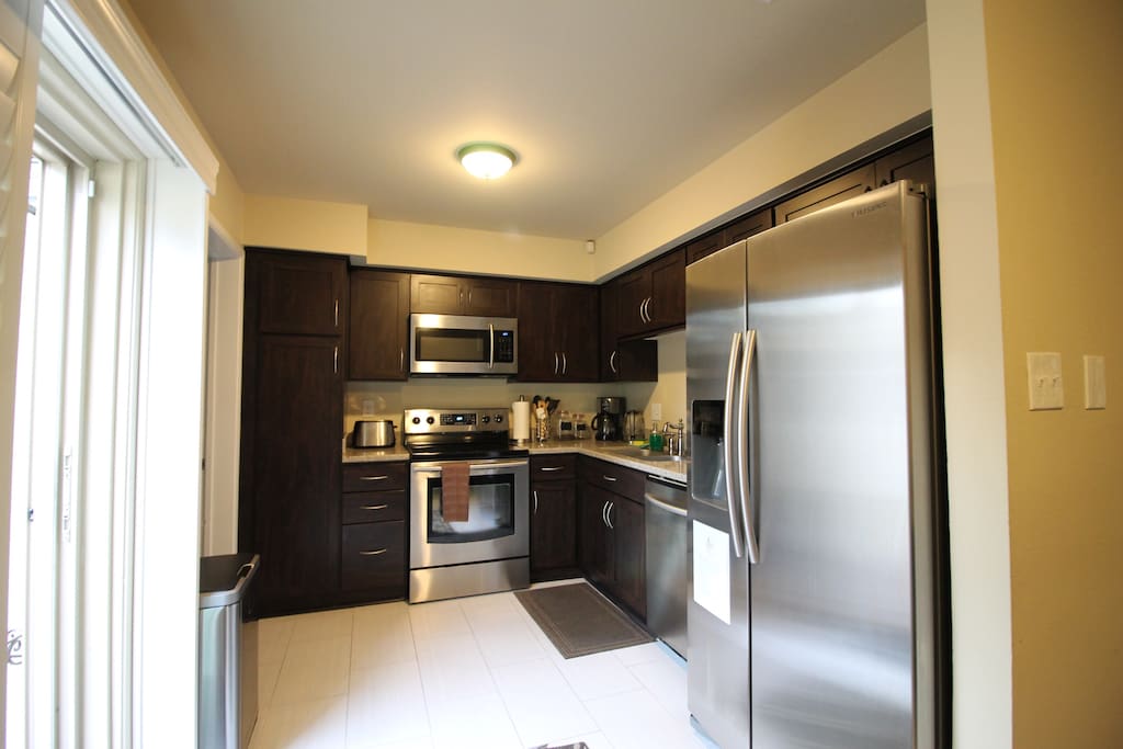 Fully-stocked kitchen with all the amenities, appliances, and utensils you need.