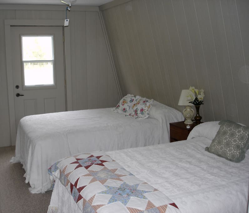 North bedroom. Two double beds