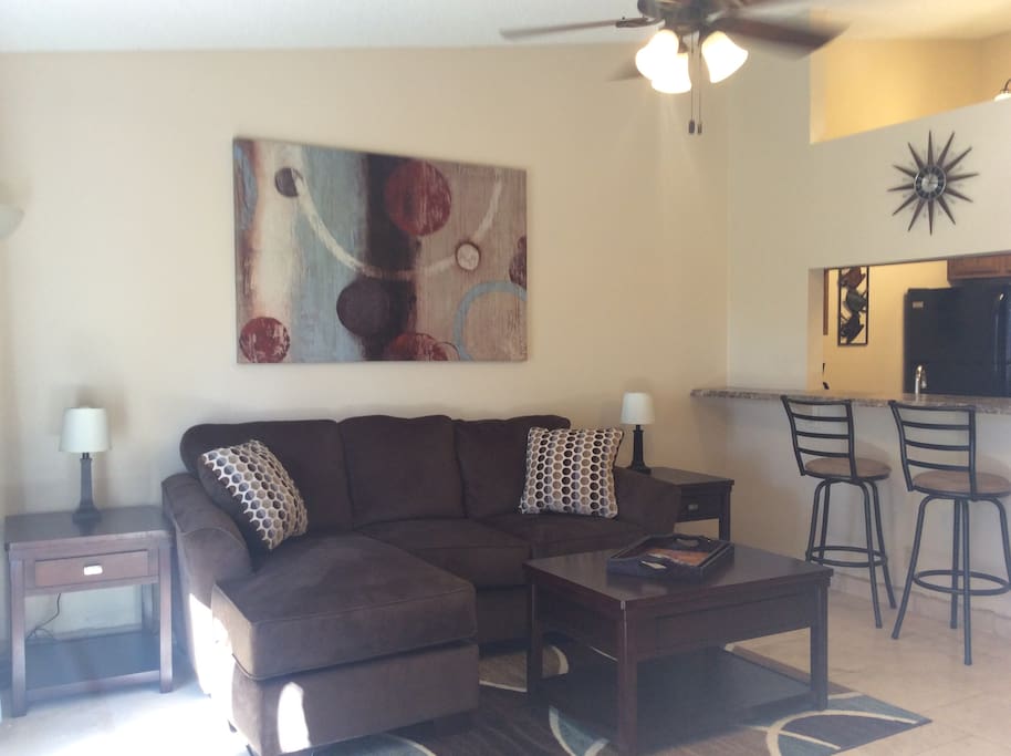 Open concept living room with a peek-a-boo view of kitchen