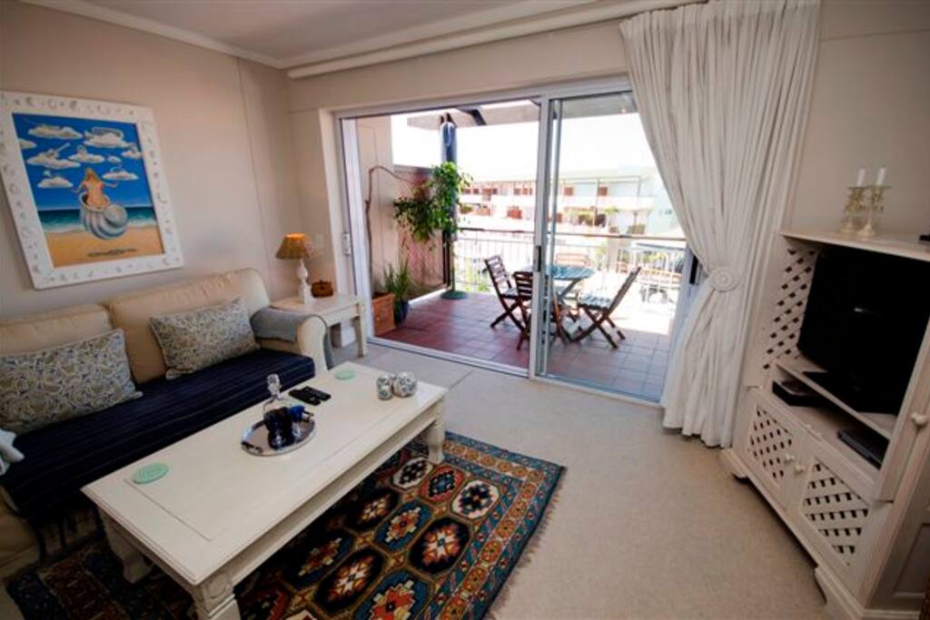 Lounge with a sofa leading onto the deck.