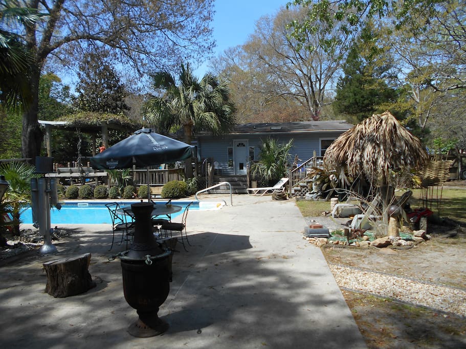 This is a view of the back yard of the house where your room is located.