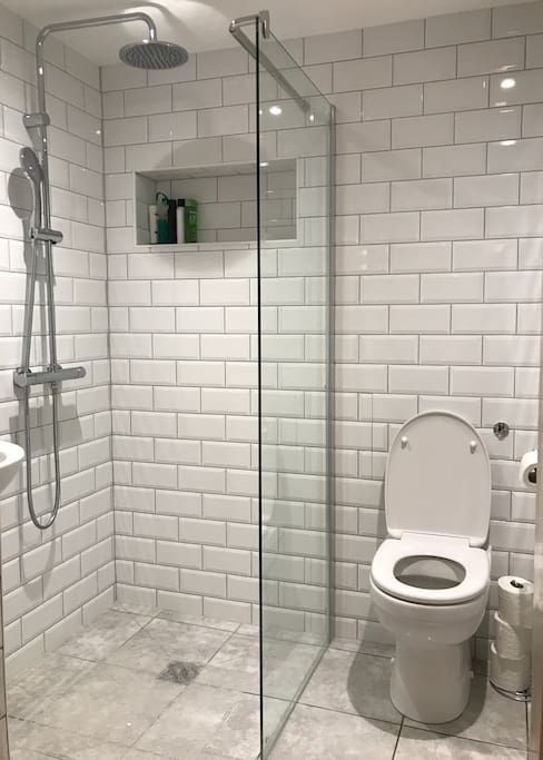 Wet room with rain shower with hand held set.