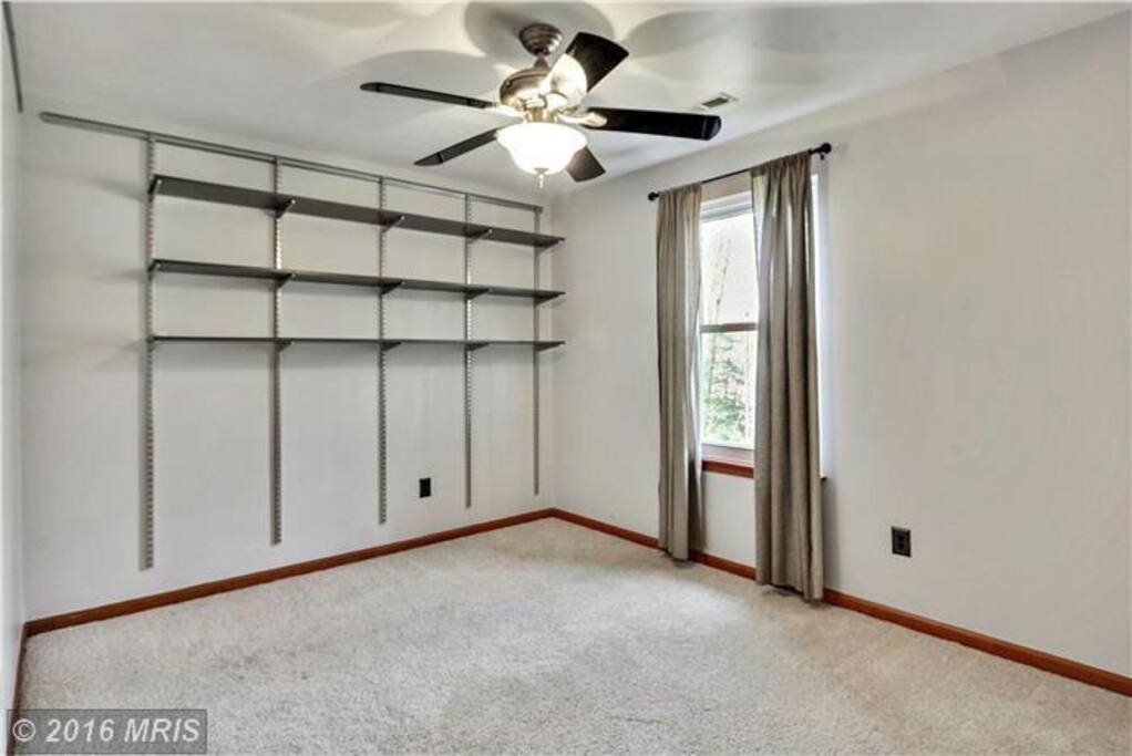 Spare bedroom (now furnished with bed and dresser)