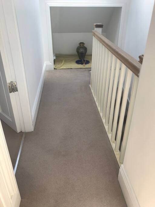 Corridor with large velux window making it very bright