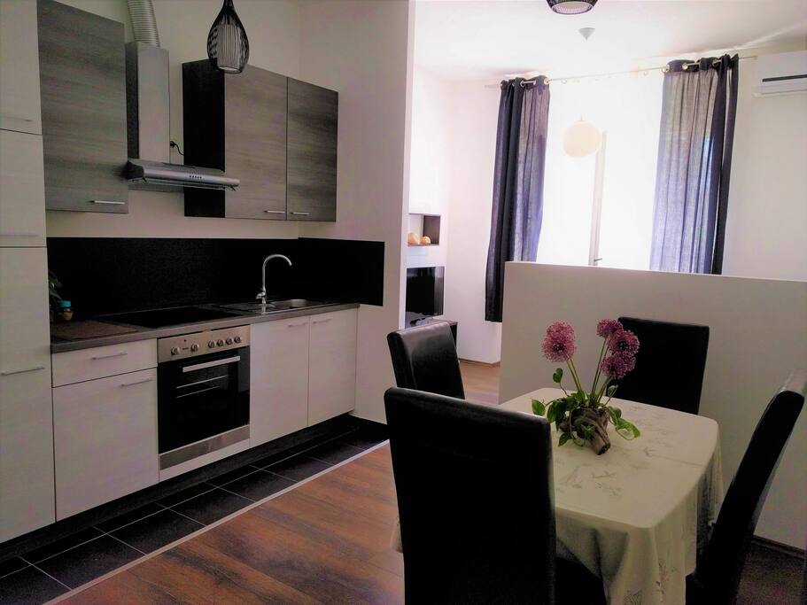 The dining area & kitchen. The living room is in the background.