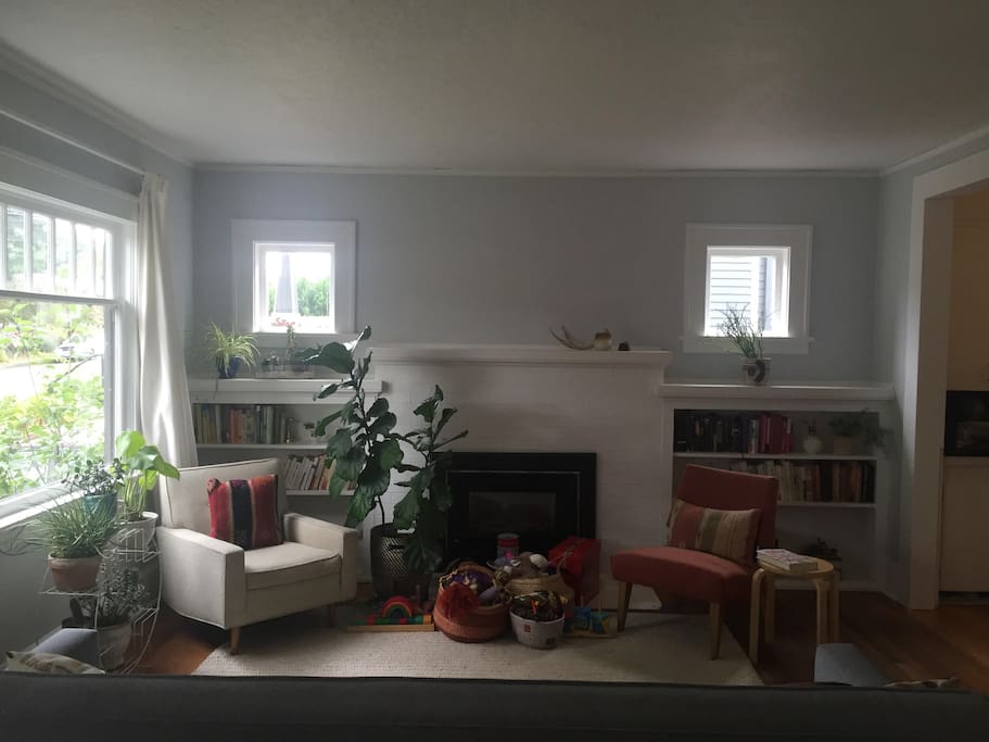 Light and plant filled, cozy living room.