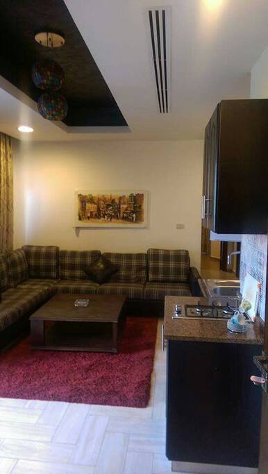Living room opened to American kitchen and balcony