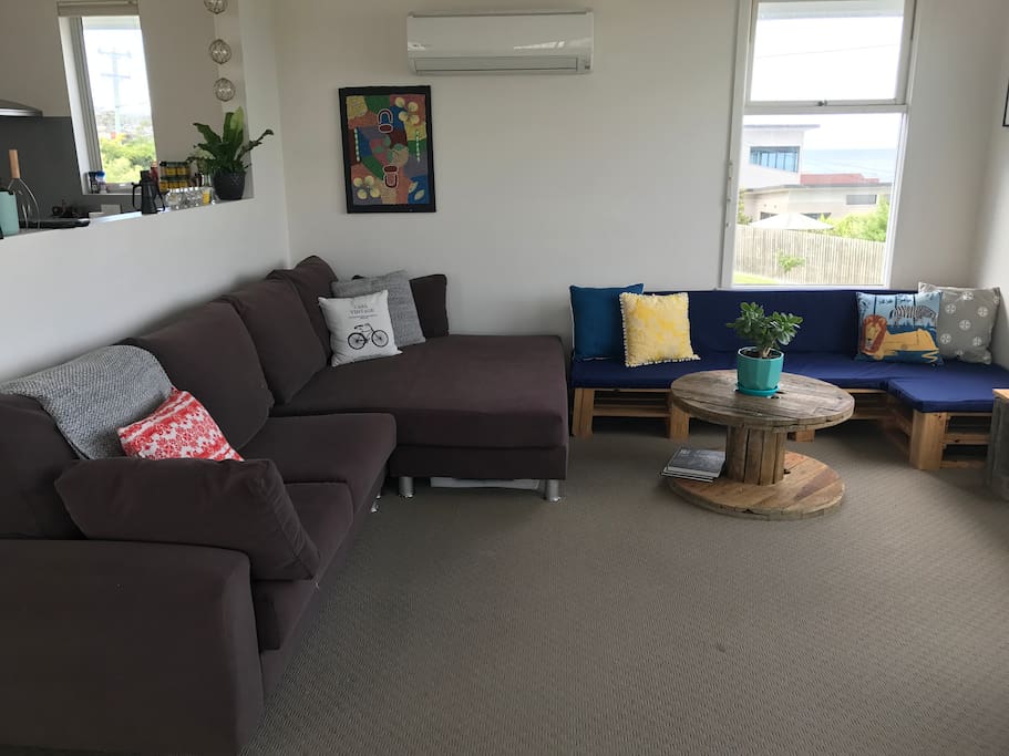 Lounge room with large comfortable couch; great for an afternoon nap.
