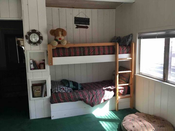 Bunk beds on the summer porch perfect for kids.