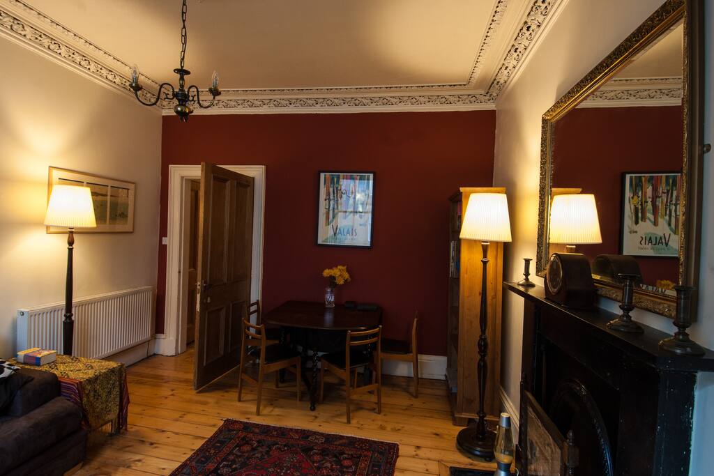 Cosy sitting room complete with traditional cornice work.