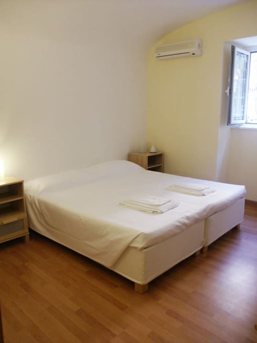 the 2 single beds can be joined in a double bed for couples