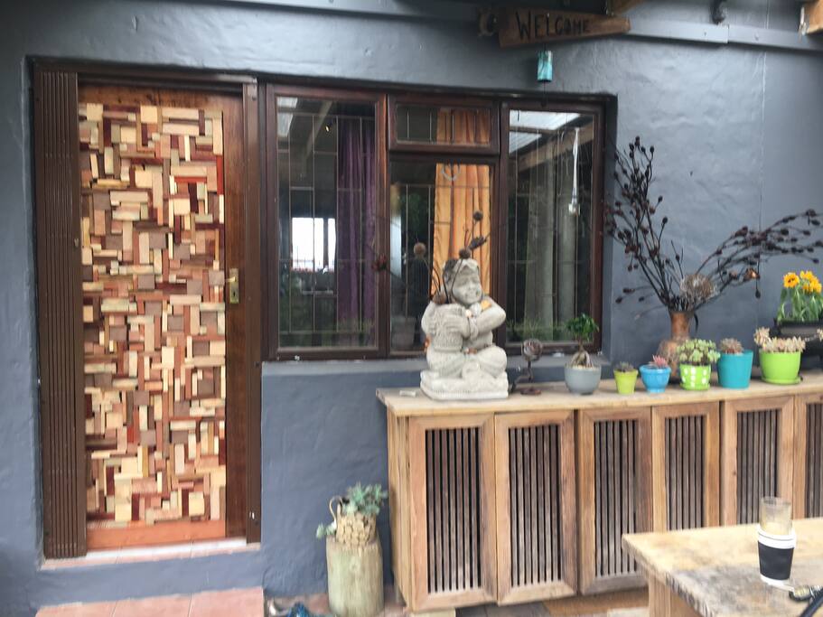 Front door and patio with 8 seater table