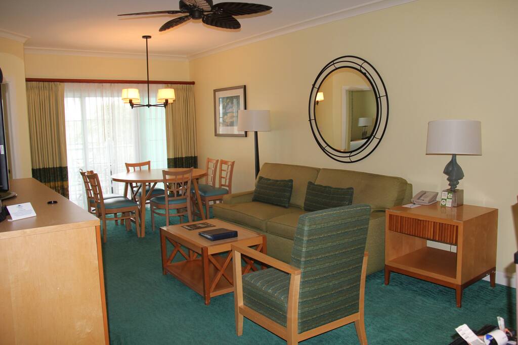 living room with pullout sofa and dining table
