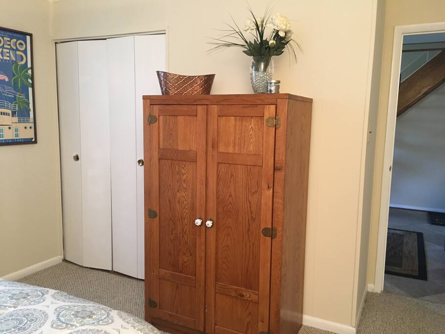 Storage chest and closet in bedroom