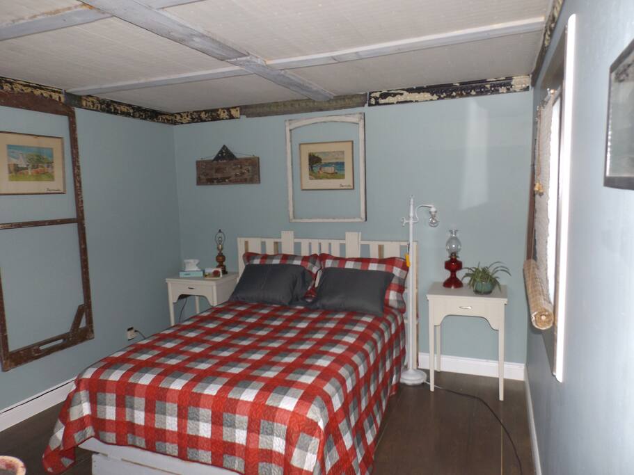 The Rustic Cabin room with dresser, armoire & TV/DVD.
