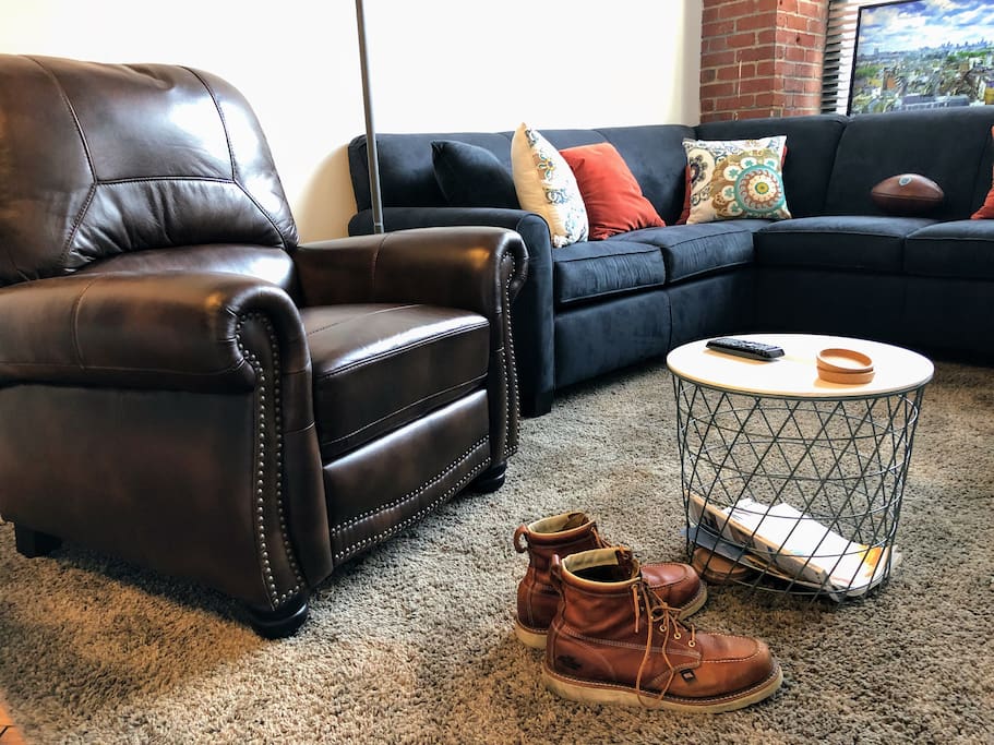 Kick your feet up and relax on the plush sectional or the leather recliner