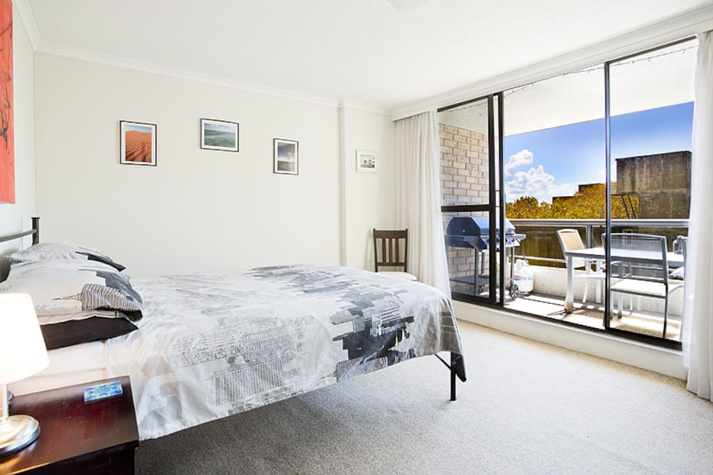 Large master bedroom leading onto the balcony