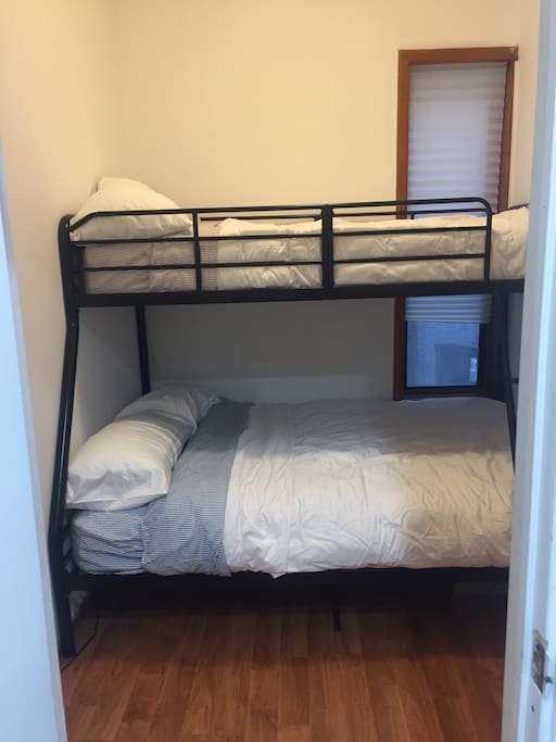 Full bed below, twin on top.