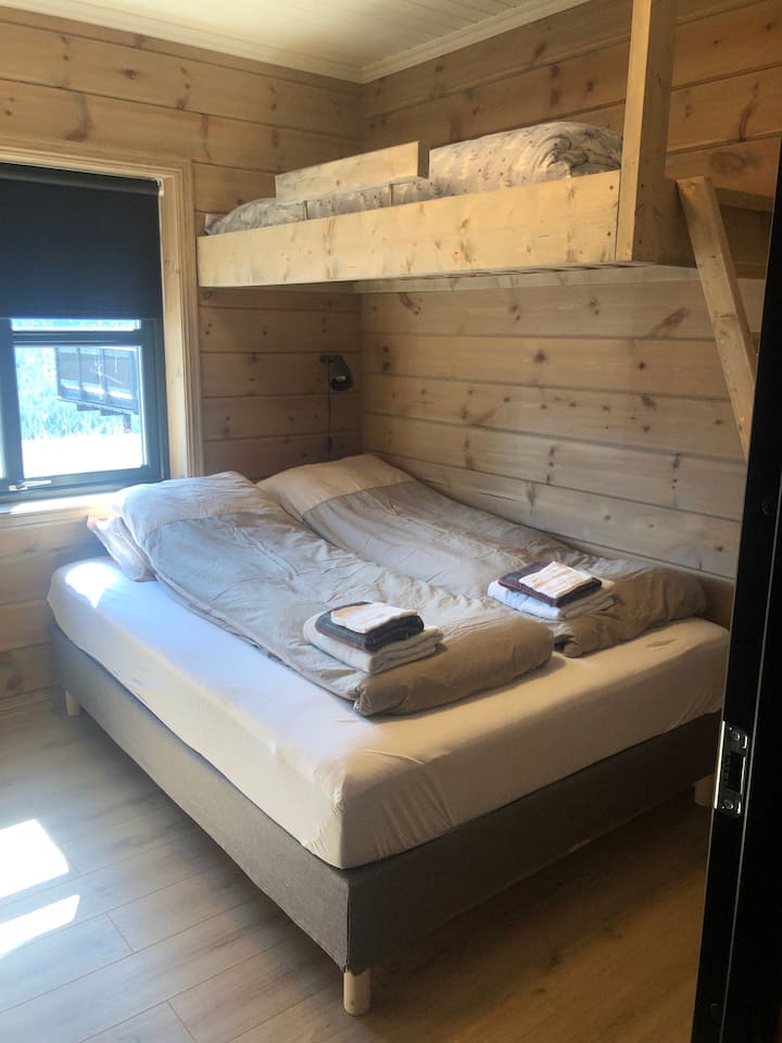 First floor bedroom with queen size bed and a single size mounted bunk bed