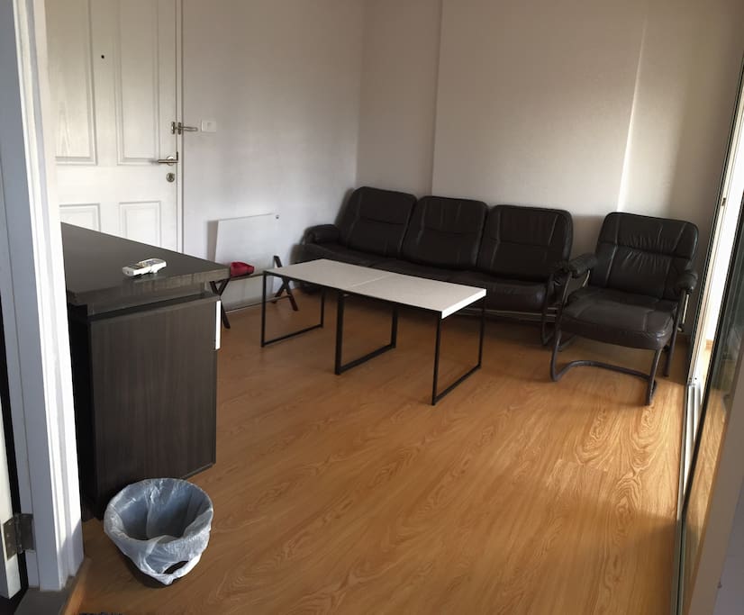 A comfortable sofa with small table .