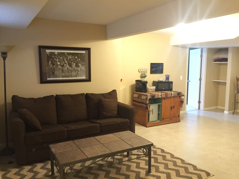 Lazy boy couch and TV in living room area
