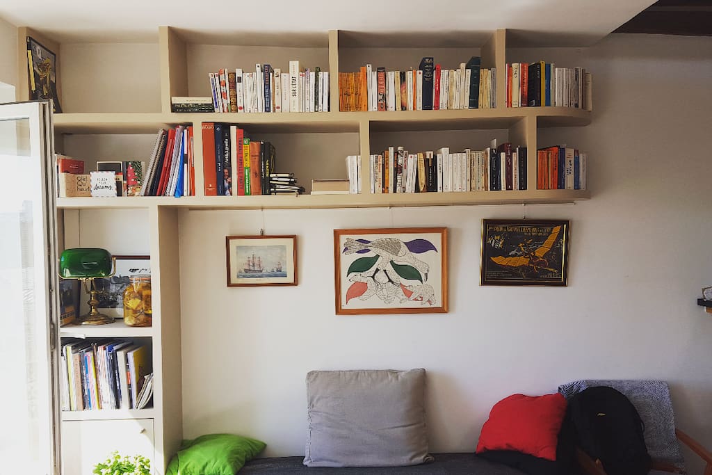 The main living room is full of books and lit all day by natural light. Feel free to pick & read if the weather's no good :)
