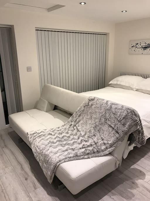 White leather sofa bed