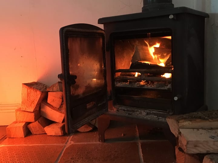 Cosy up to open fire ...  you bring the book, we'll supply the wood.