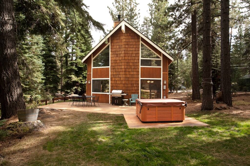 Rear of house. Hot tub, BBQ, table/chairs (weather permitting)