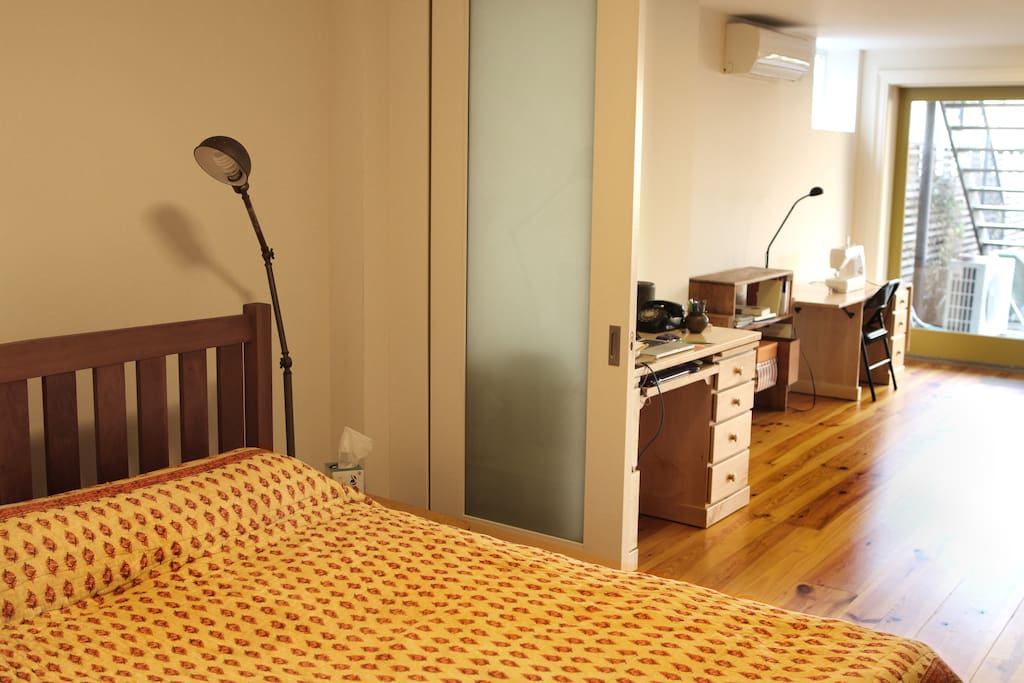 Bedroom, sliding doors open to yoga studio.